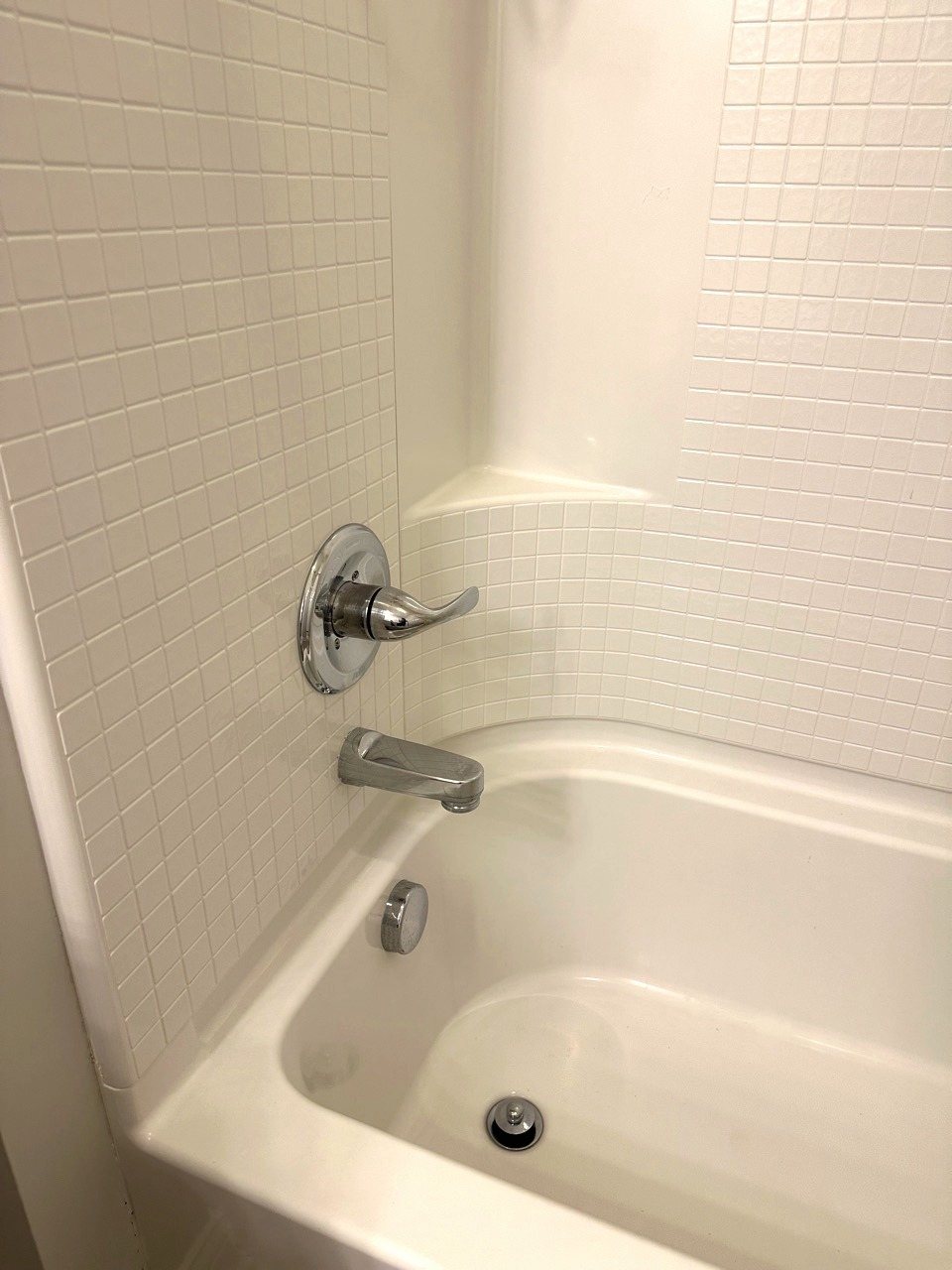A cleaned tub and tiled surround